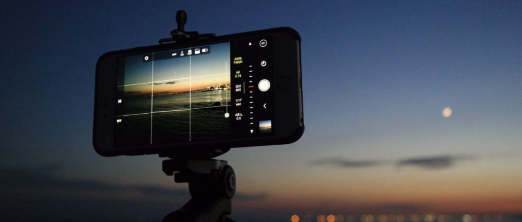 celular, grades de fotografia, tripé, por do sol